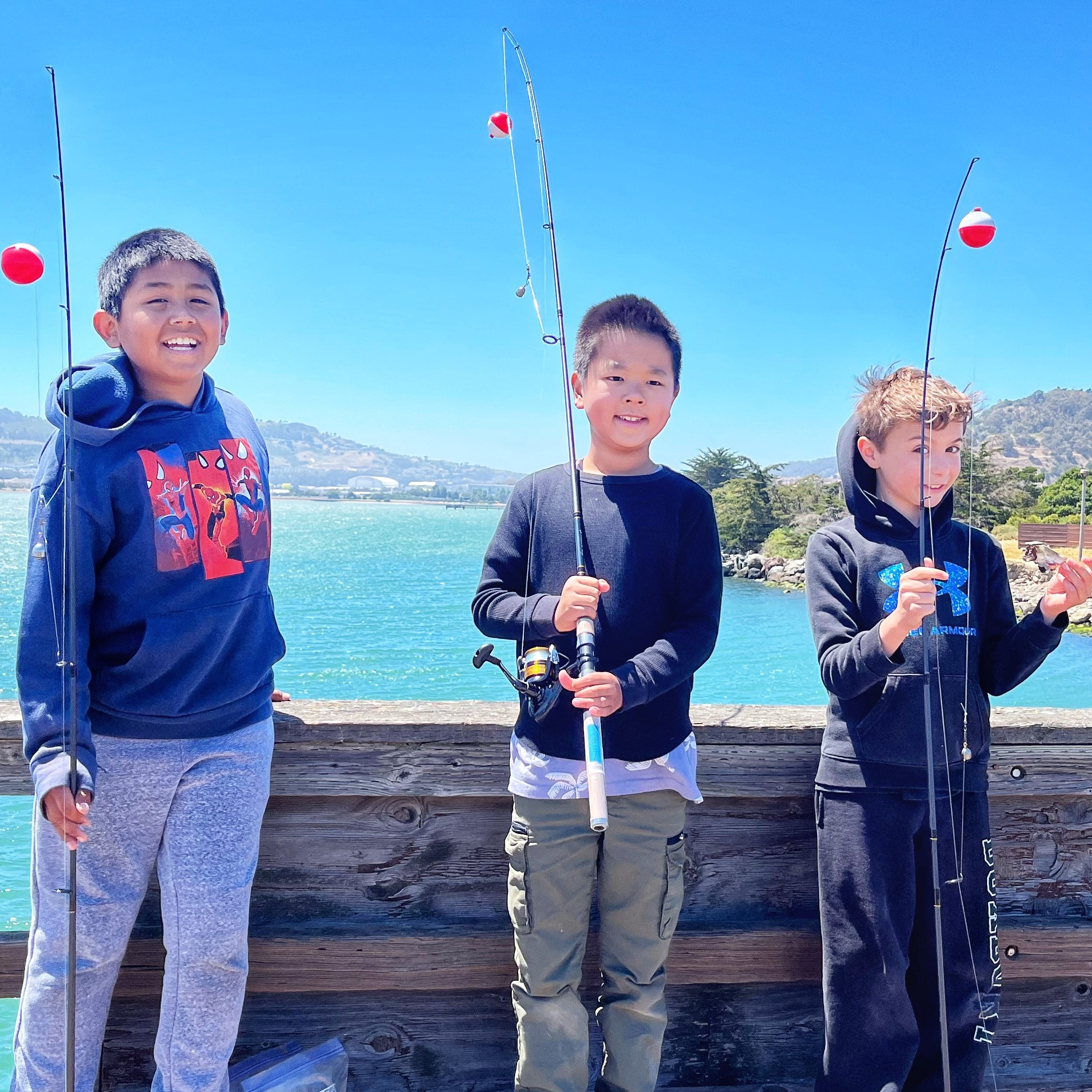 boys with fishing poles boys with fishing poles